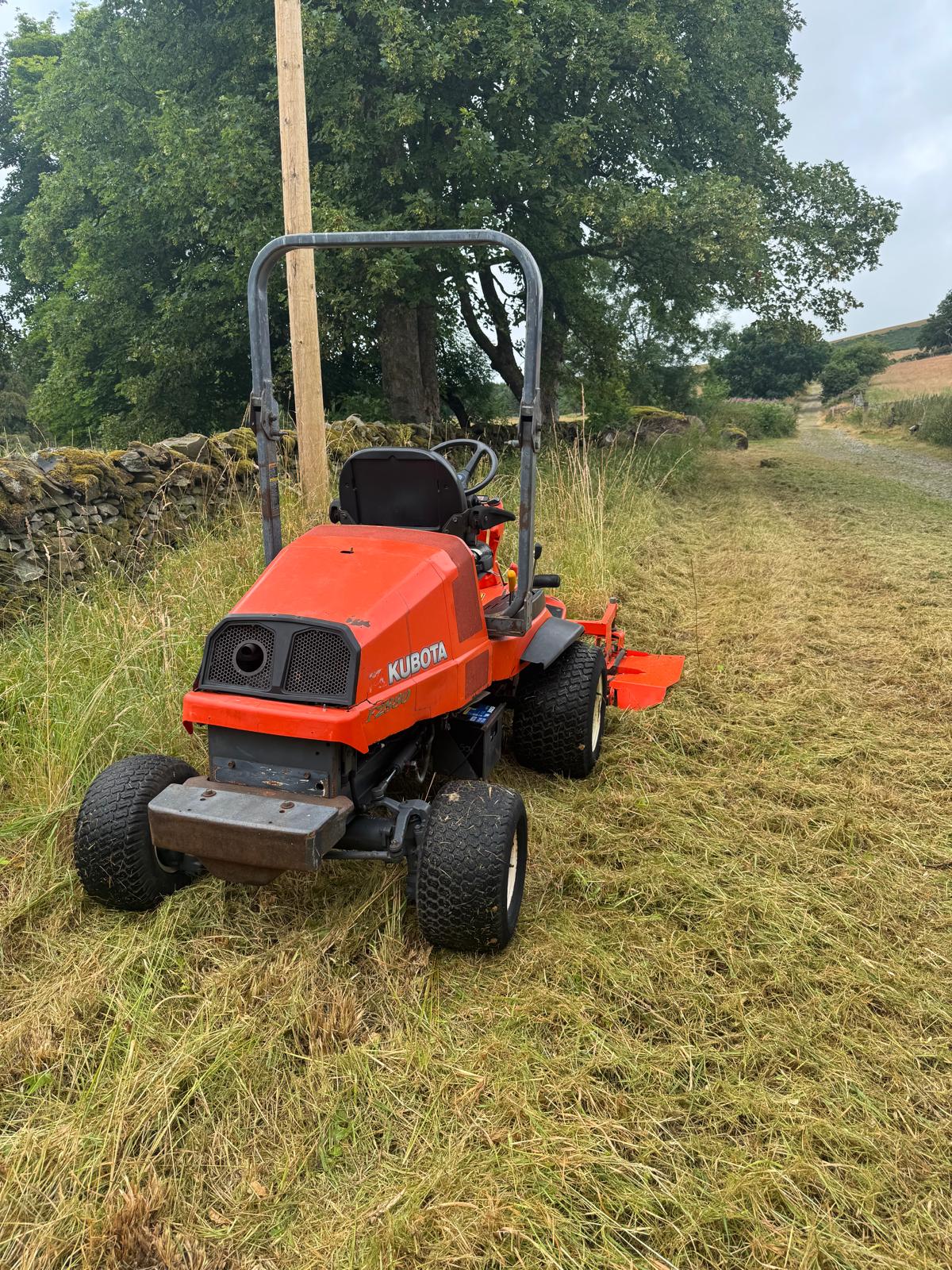Kubota out-front mower beside a cut verge