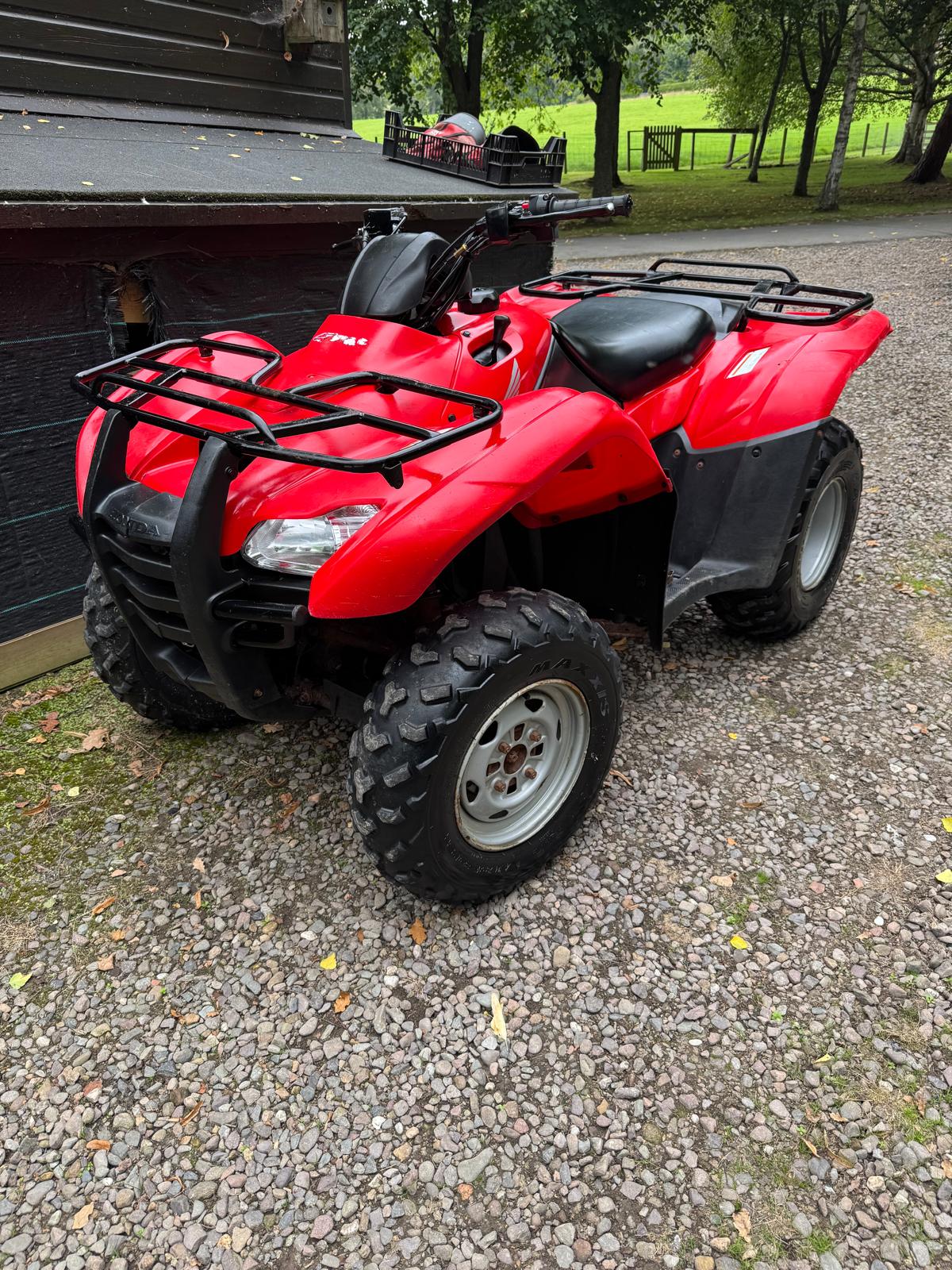 Red Honda quad bike, front view